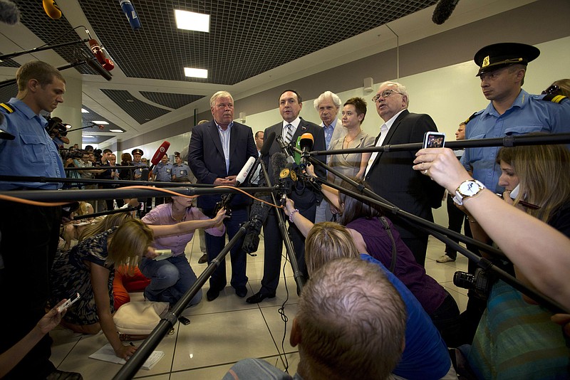 Russian lawmaker Vyacheslav Nikonov, second left, speaks to the media Friday after meeting National Security Agency leaker Edward Snowden at Sheremetyevo airport outside Moscow, Russia. Snowden wants asylum in Russia and is willing to stop sharing information as a trade-off for such a deal, according to a Parliament member who was among a dozen activists and officials to meet with him Friday. From left, lawyer Anatoly Kucherena, Vyacheslav Nikonov, lawyer Genri Reznik, member of the Russian public chamber Olga Kostina, Russia's presidential human rights ombudsman Vladimir Lukin.