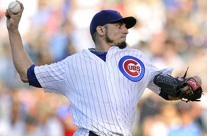 Chicago Cubs starter Matt Garza delivers a pitch during the first inning of a baseball game against the St. Louis Cardinals in Chicago, Saturday, July 13, 2013. 