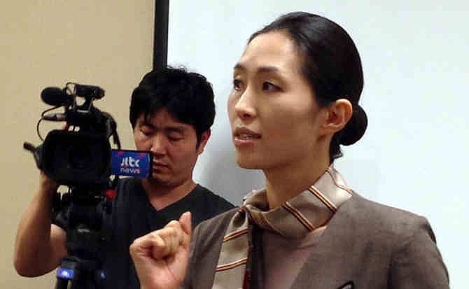 This July 7, 2013 file photo shows Asiana Airlines Flight 214 flight attendant and cabin manager, Lee Yoon Hye, speaking to the media during a news conference in San Francisco. Before Asiana Flight 214 crash-landed in San Francisco, the last time the Korean airlines' flight attendants made news was over their union's effort earlier this year to get the dress code updated so female attendants could wear trousers. Now, with half of the 12-person cabin crew having suffered injuries in the accident and the remaining attendants receiving praise for displaying heroism during the emergency evacuation, the ill-fated flight is giving a lift to the members of a profession that has worked to be recognized for more than its uniforms and food service skills. 