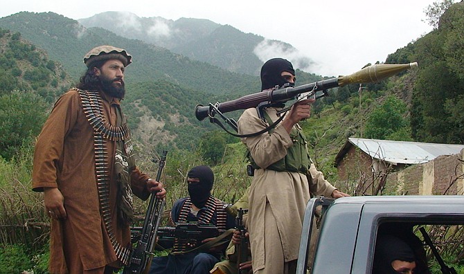 Pakistani Taliban patrol in their stronghold of Shawal in Pakistani tribal region of South Waziristan in August 2012. Dozens of domestic and foreign militants have left Pakistan for Syria in recent months.
