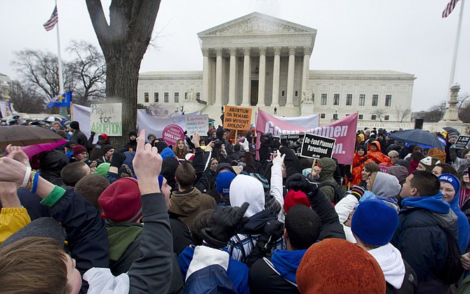 Anti-abortion and abortion rights supporters stand face to face in front of the Supreme Court in Washington, during the annual March For Life rally on January 23. Having no immediate hope to overturn the U.S. Supreme Court's Roe v. Wade decision that legalized abortion nationwide, Republicans in capitols around the country have accelerated their push for legislative restrictions on the procedure, and Democrats say they'll make the GOP pay in coming elections.