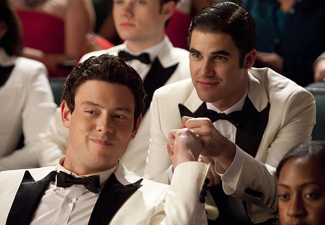 In this undated publicity image released by Fox, Cory Monteith, left, and Darren Criss are shown in a scene from "Glee." Monteith, who shot to fame in the hit TV series "Glee," was found dead in a Vancouver hotel room, police said. He was 31. 