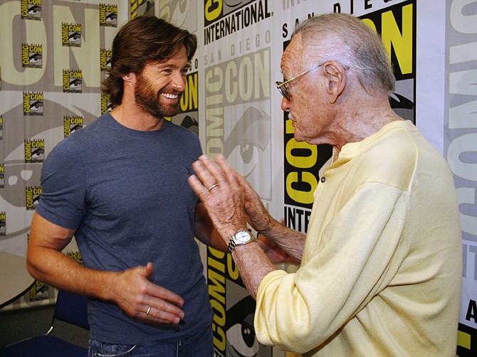 Actor Hugh Jackman, left, talks to legendary comic book creator Stan Lee, right, after an interview at the Comic-Con 2008 convention in San Diego. 