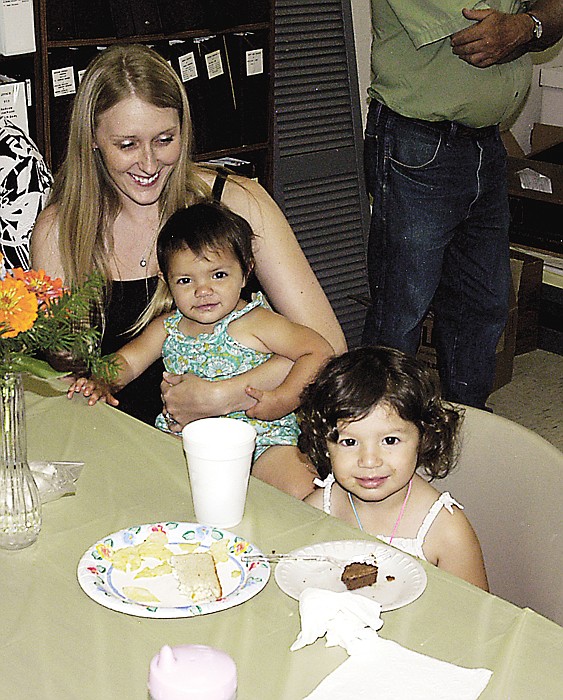 Hazel Wolford, near right, and her younger sister Meredith, held by Lisa Dube enjoy the ice cream and other food at the Moniteau County Historical Society annual ice cream social. Dube, Kansas City, is a friend of the Wolfords and was visiting.  
