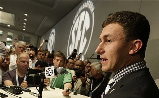 Texas A&M quarterback Johnny Manziel talks with reporters during Wednesday's session at the SEC Media Days in Hoover, Ala.