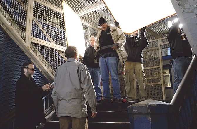 Actors and crew rehearse for scenes from the movie "Apparitional," much of which was shot on location at the old Missouri State Penitentiary in Jefferson City. The film is written, directed and produced by Andrew P. Jones, lower left, and features actress Linara Washington playing Kate. 