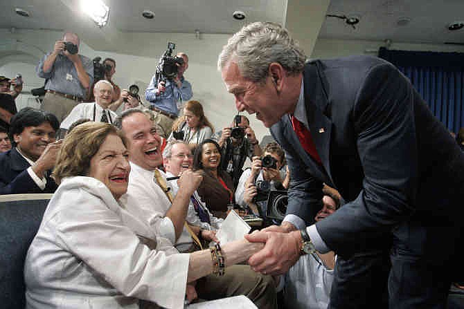 In this Aug. 2, 2006, file photo, President Bush, right, greets veteran White House correspondent Helen Thomas during the final briefing in the press briefing room in the West Wing of the White House in Washington before its renovation. Thomas, a pioneer for women in journalism and an irrepressible White House correspondent, has died Saturday, July 20, 2013. She was 92.