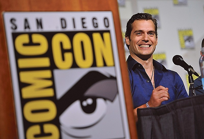 Henry Cavill attends the "Superman" 75th Anniversary panel on Day 4 of the Comic-Con International on Saturday in San Diego. Inset below, a publicity still shows Cavill as Superman in "Man of Steel."