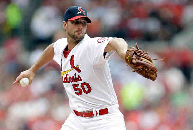 St. Louis Cardinals starting pitcher Adam Wainwright throws during the second inning of a baseball game against the San Diego Padres on Sunday, July 21, 2013, in St. Louis.