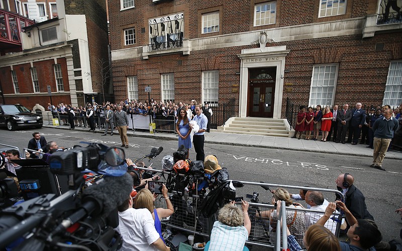 Britain's Prince William and Kate, Duchess of Cambridge hold the Prince of Cambridge, on Tuesday as they pose for photographers outside St. Mary's Hospital exclusive Lindo Wing in London where the Duchess gave birth on Monday.