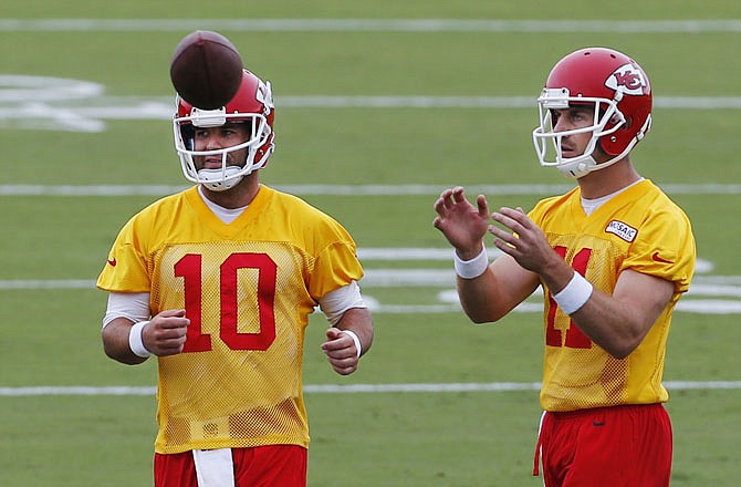 Chiefs quarterbacks Alex Smith (11) and Chase Daniel (10) work out Tuesday during training camp in St. Joseph.
