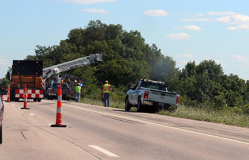 Tire marks can be seen on the pavement of westbound Highway 54 where a tanker truck blew a tire and braked, overturned and went over the embankment about one mile west of the Highway 52/54 exit south of Eldon Wednesday afternoon.  