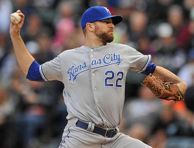 Kansas City Royals starter Wade Davis delivers a pitch during the first inning of a baseball game against the Chicago White Sox in Chicago, Saturday, July 27, 2013. 