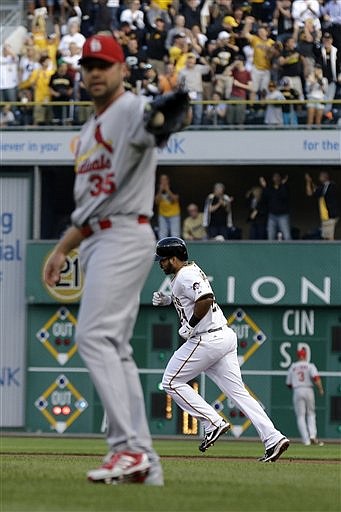 Pedro Alvarez of the Pirates rounds the bases after hitting a three-run home run off Cardinals pitcher Jake Westbrook during the first inning of Monday night's game in Pittsburgh.