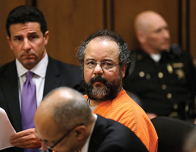 Ariel Castro sits in the courtroom July 26 in Cleveland.  Castro, who imprisoned three women in his home, subjecting them to a decade of rapes and beatings, pleaded guilty Friday to 937 counts in a deal to avoid the death penalty.