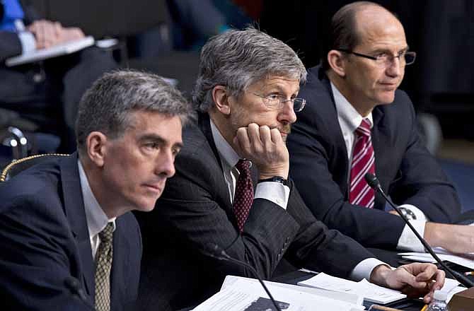 From left, National Security Agency Deputy Director John C. Inglis, Robert Litt, general counsel in the Office of Director of National Intelligence, and Sean Joyce, deputy director of the FBI., testify on Capitol Hill in Washington, Wednesday, July 31, 2013, as the Senate Intelligence Committee questioned top Obama administration officials about the National Security Agency's surveillance programs for the first time since the House narrowly rejected a proposal last week to effectively shut down the NSA's secret collection of hundreds of millions of Americans' phone records. 