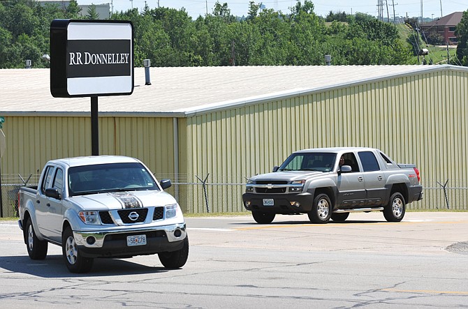 
Employees of RR Donnelley leave work at the end of the shift for the first time after hearing that the Jefferson City facility will close Oct. 1. 