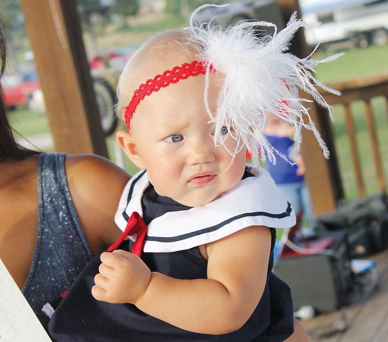 Mabel June glances off to the judges as she's announced the winner of the 7-12 month category of the 2013 Kingdom of Callaway County Fair Baby Contest. For the complete list of winners, see today's edition of the Fulton Sun.