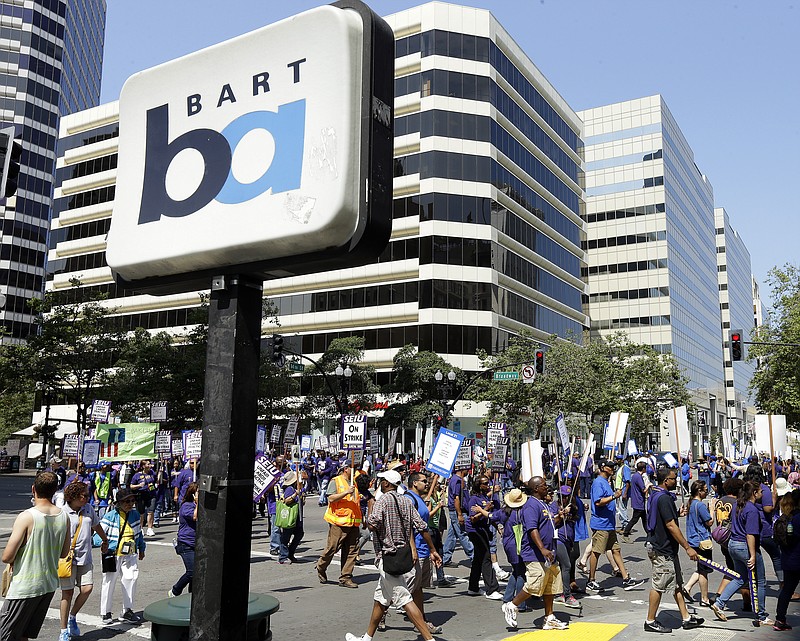 Striking Bay Area Rapid Transit workers picket July 1 as they close the intersection of 14th & Broadway in downtown Oakland, Calif. San Francisco Bay Area commuters braced for the possibility of another train strike as the Bay Area Rapid Transit agency and its workers approached a deadline to reach a new contract deal.