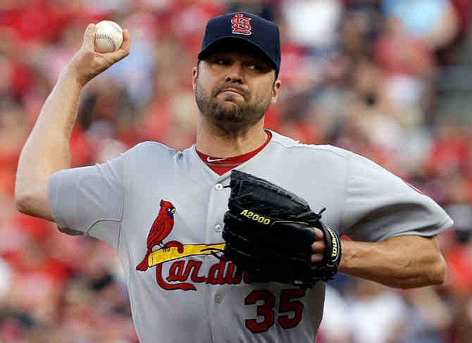 St. Louis Cardinals starting pitcher Jake Westbrook throws against the Cincinnati Reds in the first inning of a baseball game, Saturday, Aug. 3, 2013, in Cincinnati. 