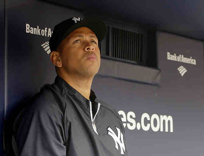 This April 13, 2013, file photo shows New York Yankees' Alex Rodriguez sitting in the dugout during a baseball game at Yankee Stadium in New York.