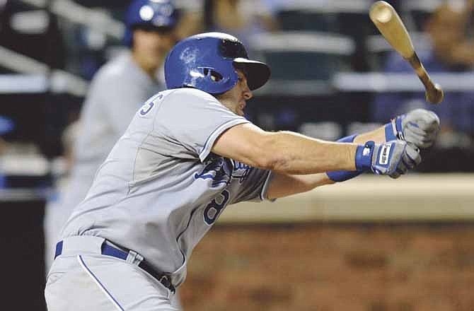 Kansas City Royals' Mike Moustakas loses his bat while swinging at a pitch during the fourth inning of an interleague baseball game New York Mets Friday, Aug. 2, 2013 at Citi Field in New York. 