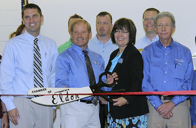 Eldon School Disrict Superintendent Matt Davis, Eldon Career Center Director Willard Haley, State Fair Community College President Joanna Anderson and SFCC-Lake of the Ozarks Director John McMahon commemorate the opening of three SFCC programs at the Eldon Career Center at a ribbon-cutting ceremony hosted by the Eldon Chamber of Commerce July 30, 2013.