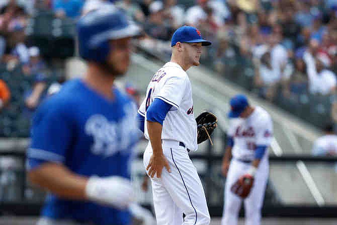 New York Mets starting pitcher Zack Wheeler reacts after giving up three runs in the fifth inning of an inter-league baseball game against the Kansas City Royals at Citi Field, Sunday, Aug. 4, 2013, in New York. 