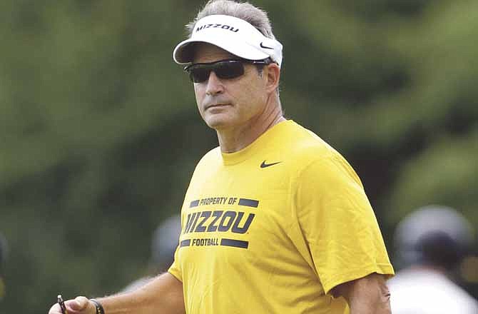 Missouri head coach Gary Pinkel watches the first practice of the season Thursday in Columbia.