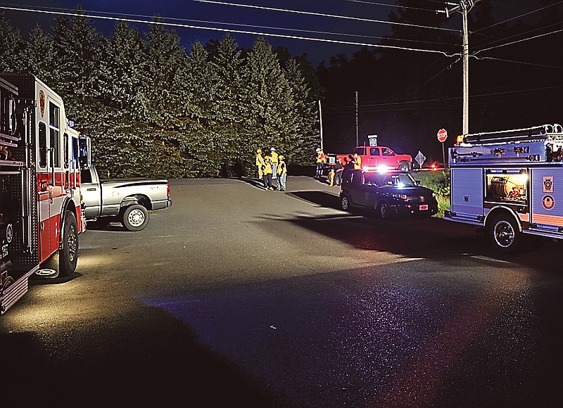 Emergency crews respond to a shooting at the Ross Township monthly meeting that left three people dead in Saylorsburg, Pa. The gunman has been captured and is in state police custody.