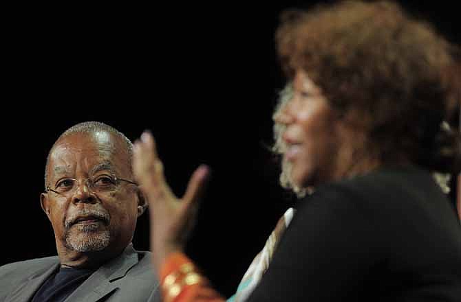 Henry Louis Gates Jr., left, executive producer of "The African Americans: Many Rivers to Cross with Henry Louis Gates Jr.," listens to civil rights icon Ruby Bridges during a panel discussion on the show at the PBS Summer 2013 TCA press tour at the Beverly Hilton Hotel on Wednesday, Aug. 7, 2013 in Beverly Hills, Calif.