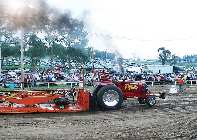 Basket Case driven by Ronnie Green, Chilohowee, took second place in the 5900 Pro-Field Tractors pulling 315.08.
