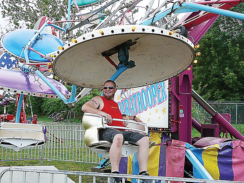 The big and little enjoyed rides on the Midway at the Moniteau County Fair Monday, Aug. 5, 2013.