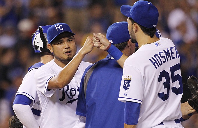 Royals first baseman Eric Hosmer congratulates Bruce Chen after the Kansas City starter left for a reliever in the top of the eighth inning of Thursday night's game against the Red Sox at Kauffman Stadium.