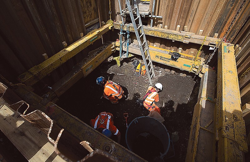 Bones and artifacts are uncovered by archaeologists on a site near London's Liverpool Street railway and tube station during the building of the new hi-speed rail line in London.