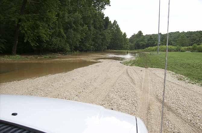 Due to the excessive overflow of the Osage Beach City Park's pond, most of its roadways were washed out or covered in debris.