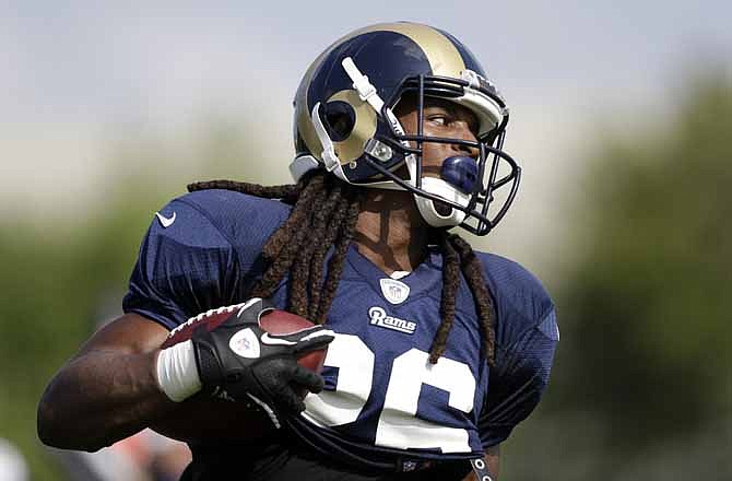 St. Louis Rams running back Daryl Richardson runs with the ball during training camp at the NFL football team's practice facility Wednesday, July 31, 2013, in St. Louis.