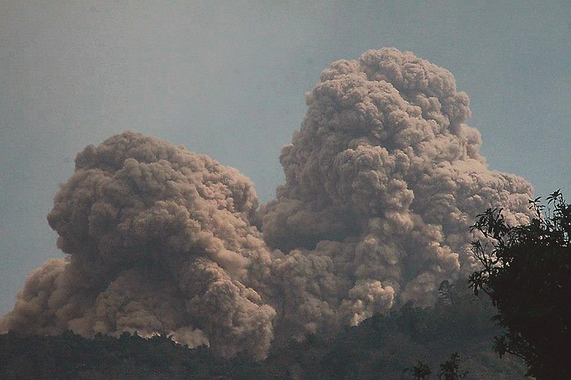 Mount Rokatenda spews volcanic material as it erupts on Palue island on Sunday.