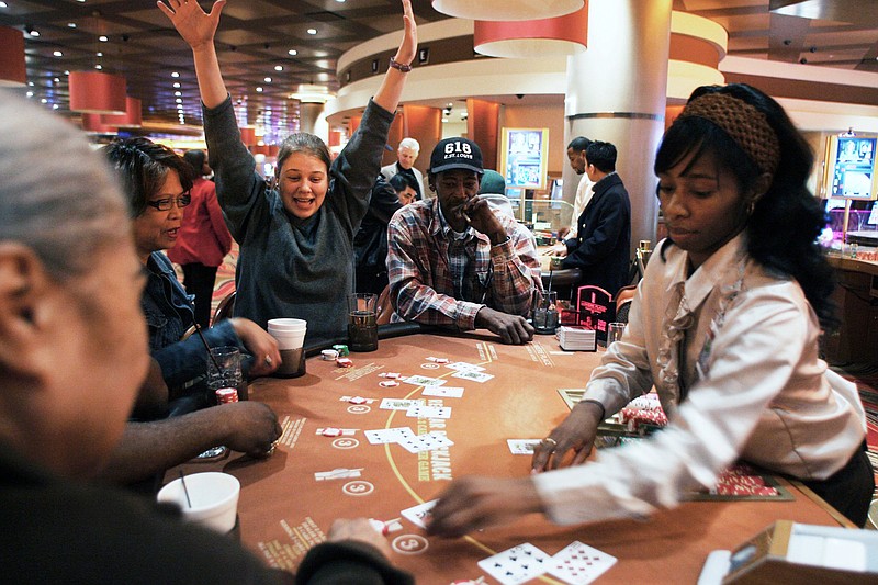 Kelli Brown, of Nashville, Tenn., celebrates as she wins in February 2008 on a hand on black jack at the Lumiere Place casino in downtown St. Louis.