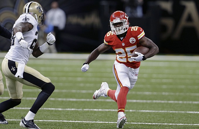 Chiefs running back Jamaal Charles tries to avoid the tackle attempt of Keenan Lewis of the Saints during the first half of last Friday's game in New Orleans.