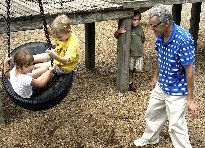 At right, Arthur Hatch, of Jefferson City, pushes grandchildren Haley and Brandon Miller, ages 5 and 6, on a swing Tuesday at Memorial Park. Haley will enter kindergarten, while brother Brandon will be in first grade this year. Both attend Cedar Hill Elementary School. This is the last day of the summer that Hatch and his wife, Barbara, will be able to spend with the children before the start of school.