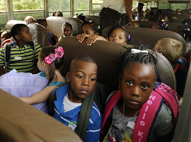 South students fill the seats while waiting on the bus to leave after their first day back at school.