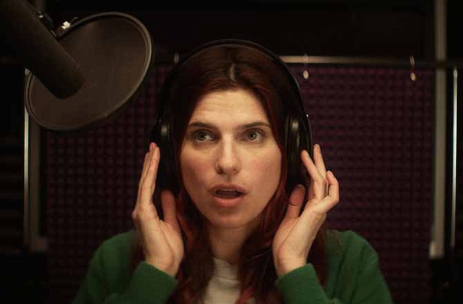 This publicity photo released by Roadside Attractions shows Lake Bell in a scene from the film "In a World...," a comedy about a struggling voice coach. Written and directed by Bell, who also stars in the film, it won the Sundance 2013 Waldo Salt Screenwriting Award for the script. 