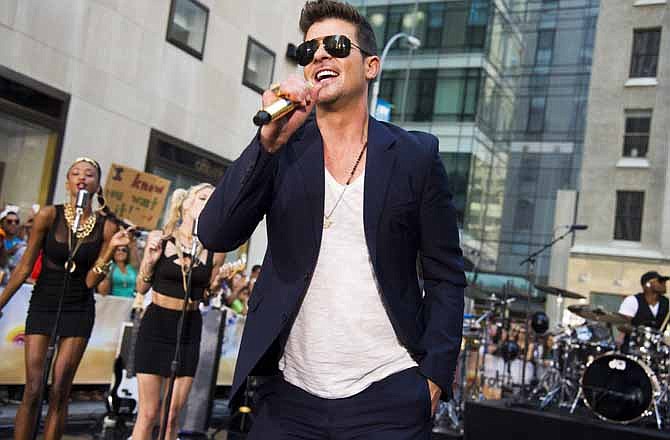 In this July 30, 2013 file photo, Robin Thicke performs on NBC's "Today" show in New York. Thicke's single "Blurred Lines," featuring T.I. and Pharrell is one of the top songs of the summer.