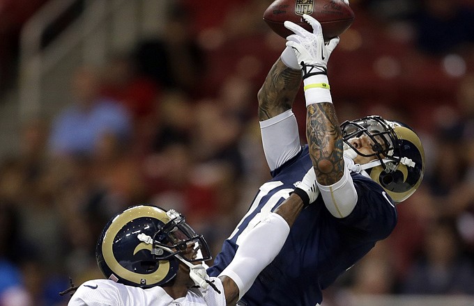 Rams wide receiver Austin Pettis (right) catches a pass as cornerback Janoris Jenkins defends during a scrimmage earlier this month at the Edward Jones Dome.