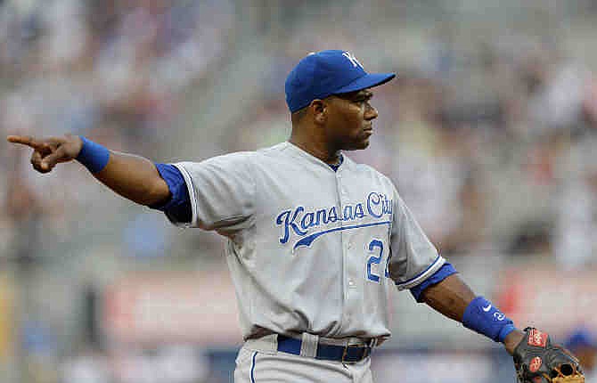  In this July 9, 2013 file photo, Kansas City Royals shortstop Miguel Tejada points to the third base umpire who ruled a strikeout in a baseball game in New York. Tejada was suspended for 105 games for testing positive for amphetamines, the MLB announced in a statement Saturday, Aug. 17, 2013.