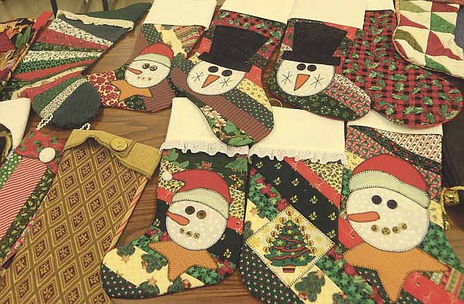 
Some of the many Christmas stockings that will be donated to area food pantries for distribution. Volunteers from the Missouri River Quilt Guild made these.