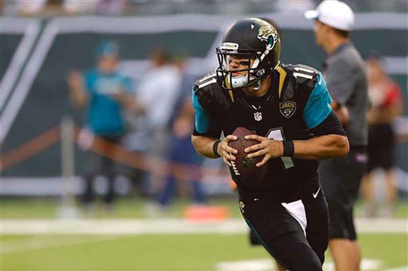 Jaguars quarterback Blaine Gabbert looks to pass while warming up before Saturday's preseason game against the Jets.