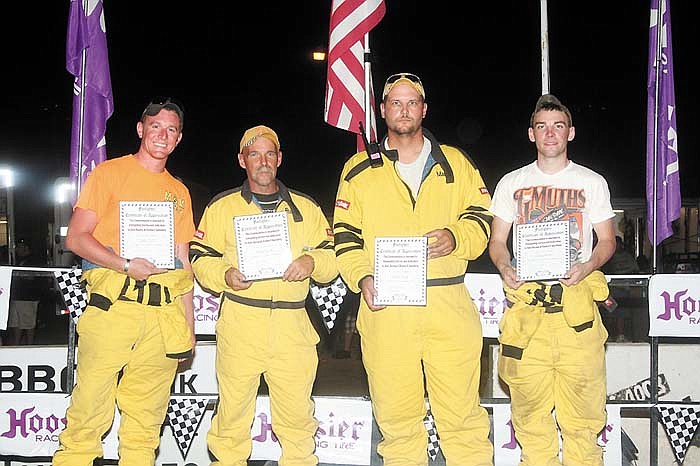 The Appreciation Award was presented to the Double-X Speedway Fire and Safety Crew at the final races of the season Aug. 11, for outstanding service and dedication to the Speedway and auto racing. From left are crewmen Jake Dill, Shawn Merrill, Mark Cram and Zachary Merrill. Matt Taylor and Shane Merrill are not shown.