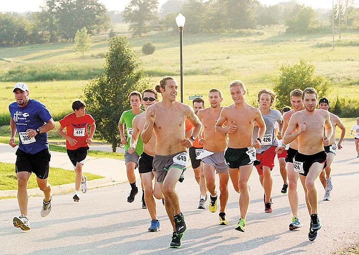 Participants of the Waylon Martensen Endure the Race 5K Walk/Run Memorial Saturday night on a residential street behind the California High School track. 